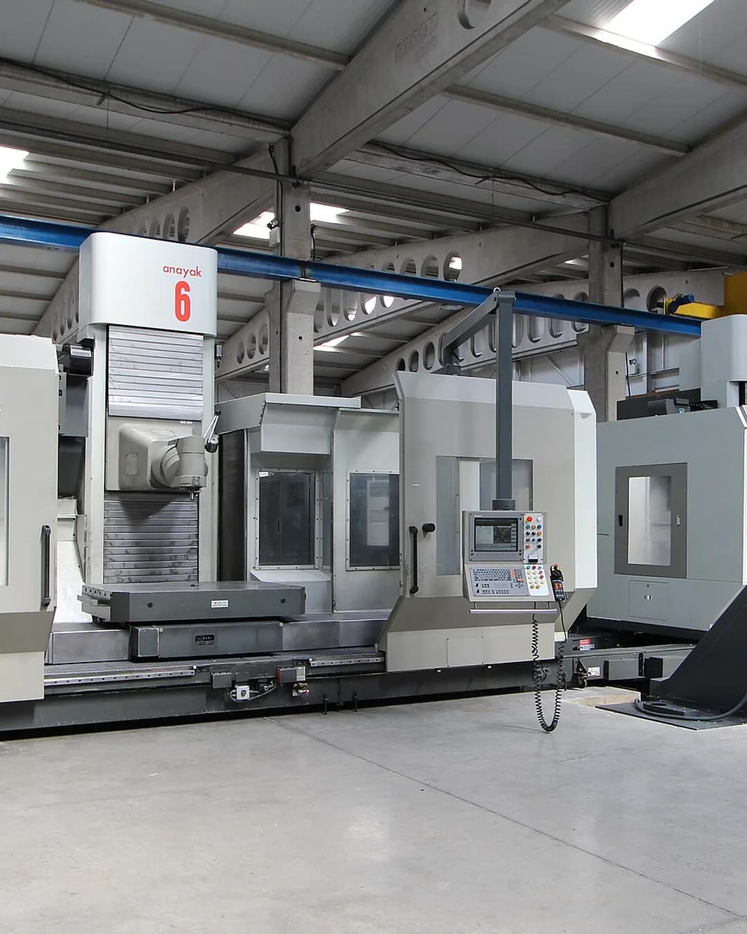 A line of CNC machining centres in a factory hall