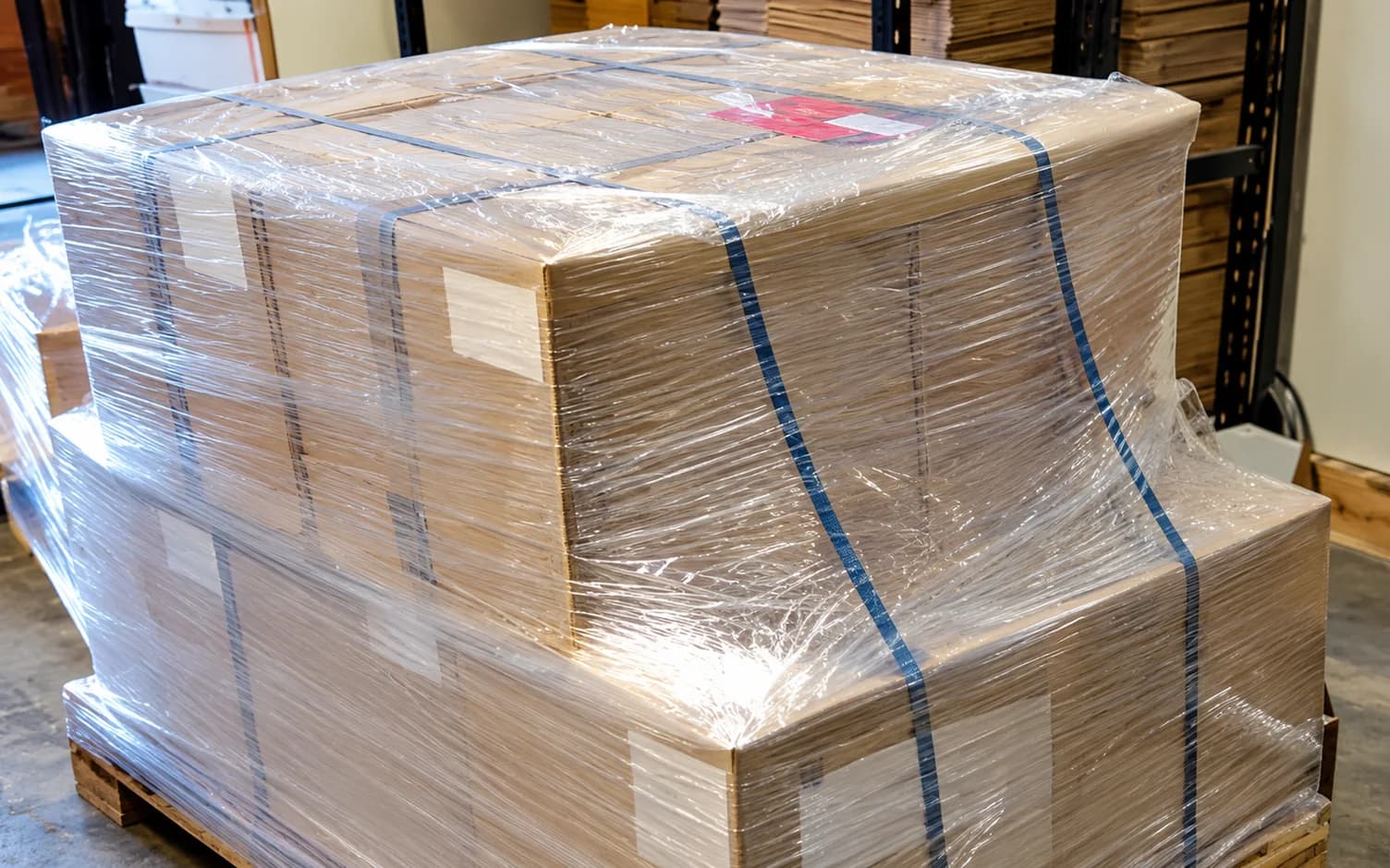 Cartons stacked on a pallet, stretch-wrapped and strapped ready for dispatch