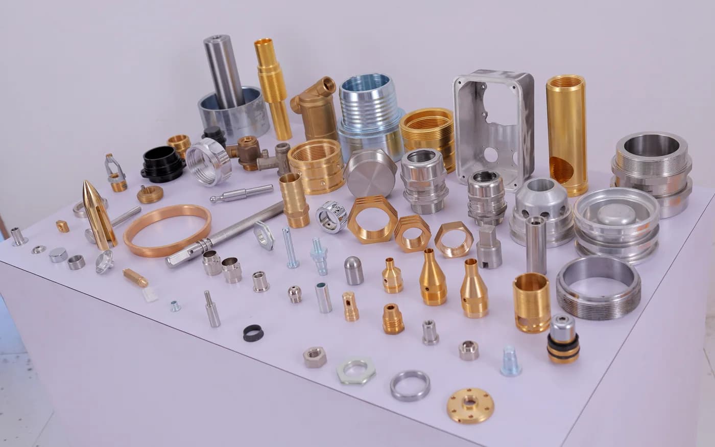 Brass, stainless, aluminium and copper components from across the range, laid out together