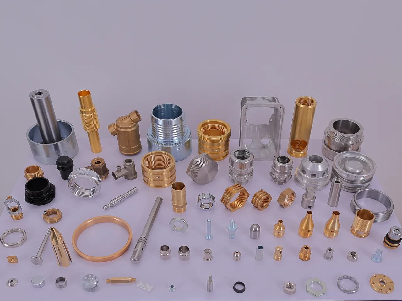 Brass, stainless, aluminium and copper components from across the range, laid out together