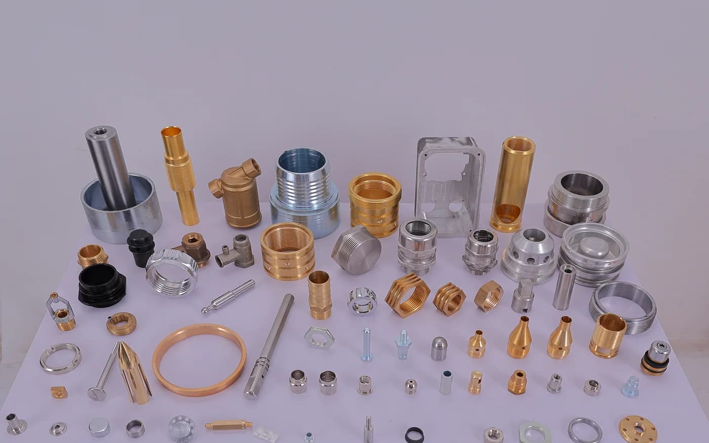 Brass, stainless, aluminium and copper components from across the range, laid out together