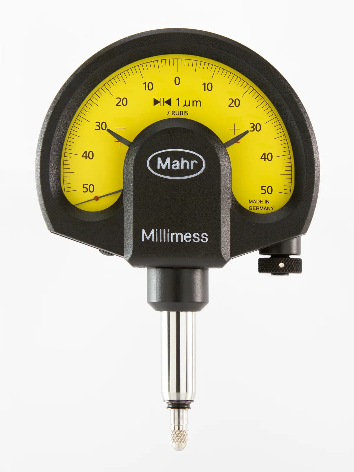 A mechanical dial comparator, one of the calibrated instruments used for final dimensional inspection