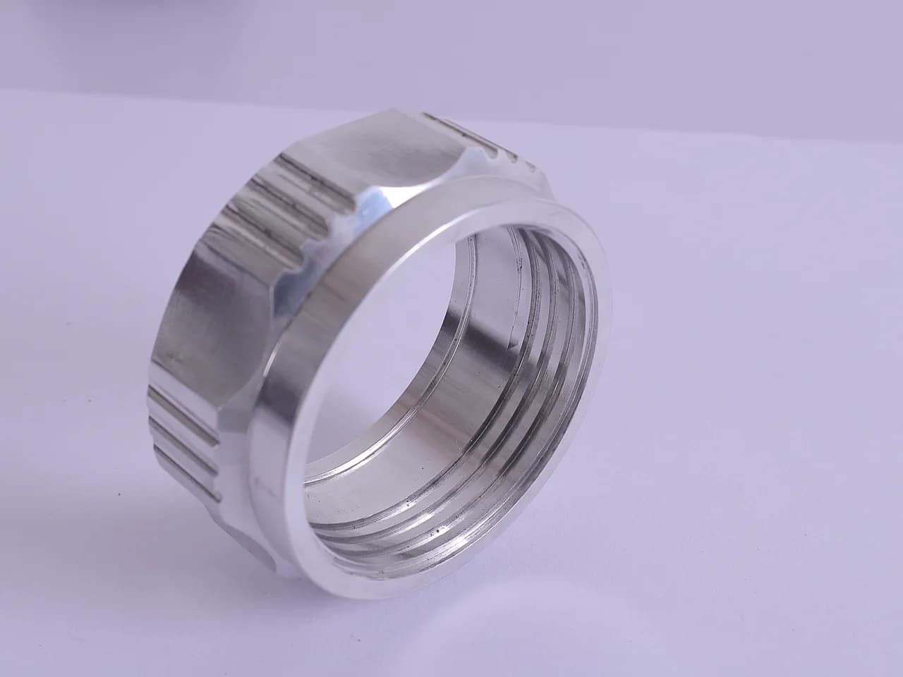 Machined threaded lock ring with milled grip slots